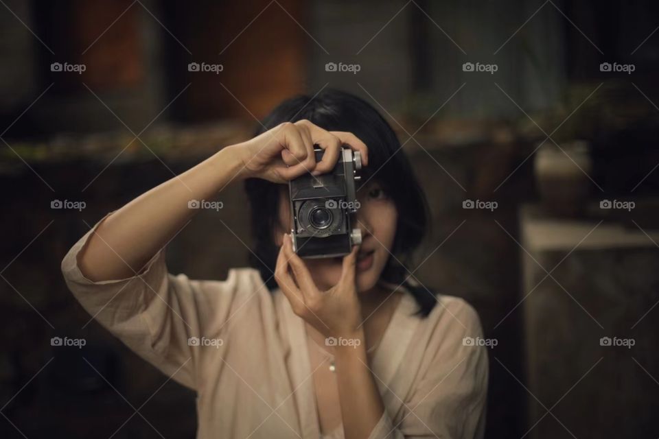 woman taking camera for front view
