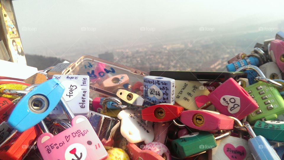 Love Locks. locks left behind by lovers around the world who visit Seoul tower