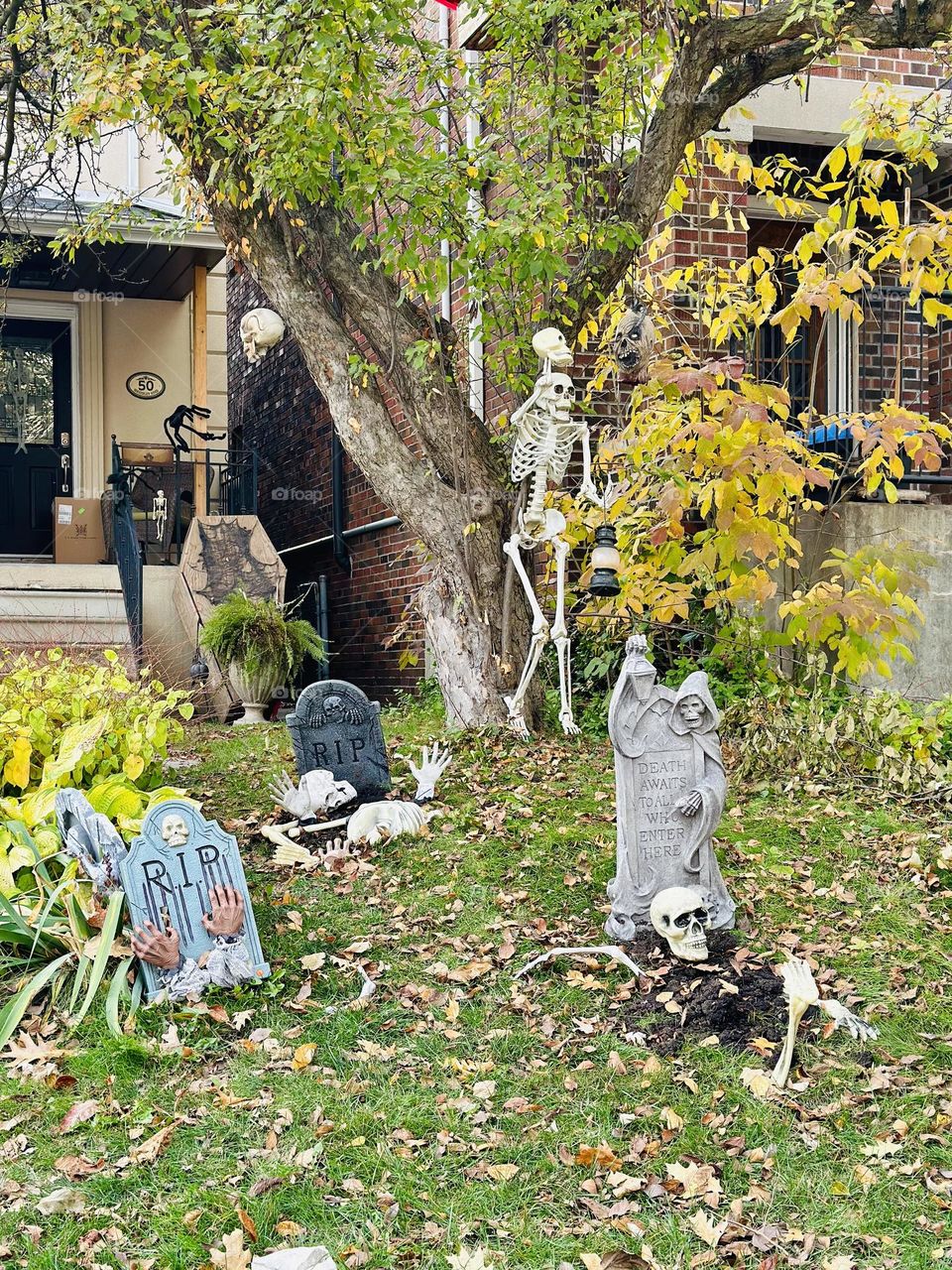 Halloween decorations and celebration in Toronto, Ontario. Ghosts, witches and skeletons. Creative art. Autumn, fall city landscape.