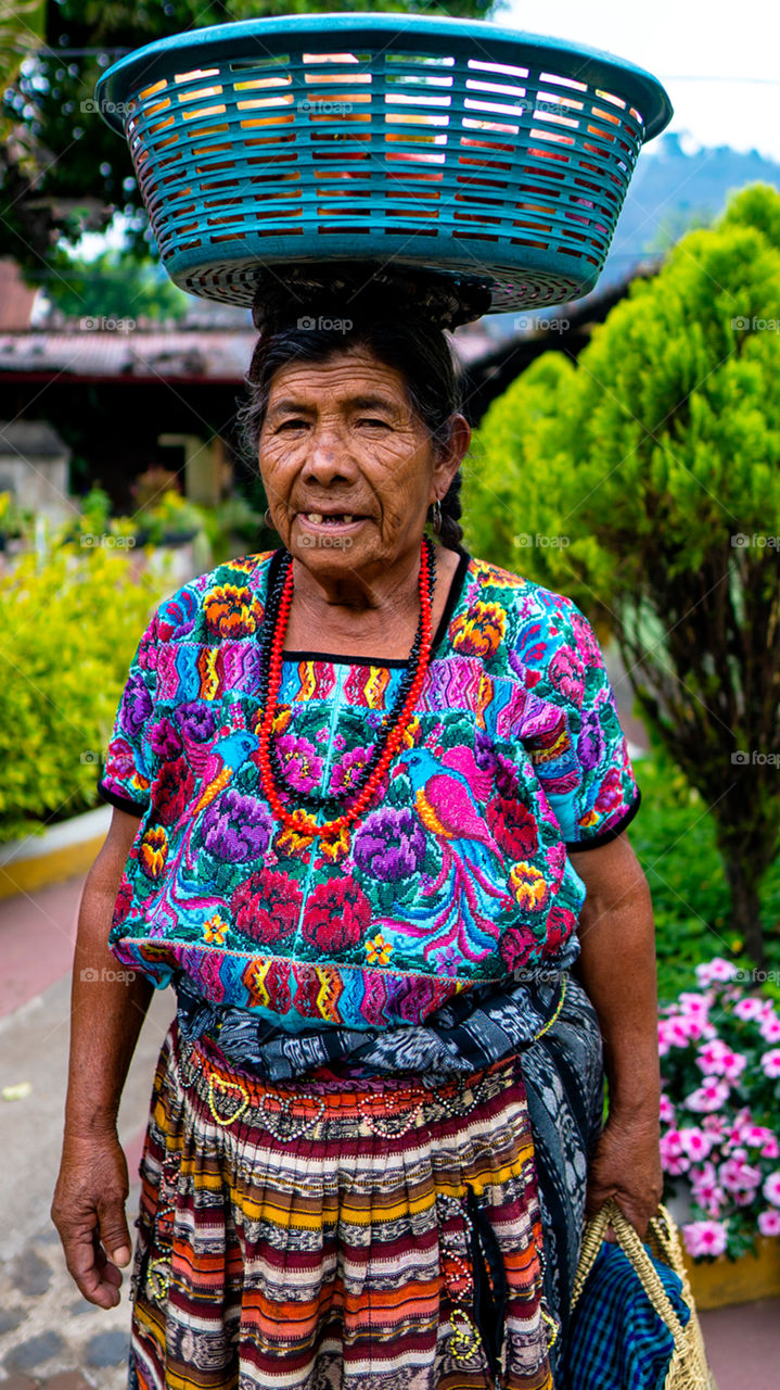 A mayan woman from Guatemala selling fruits.