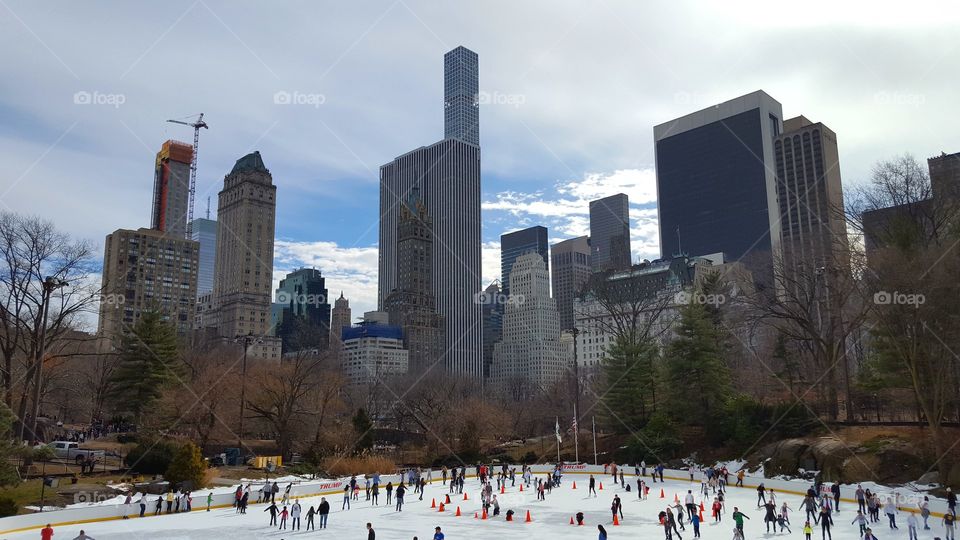 New York City - Central Park- ice skating and skyscrapers