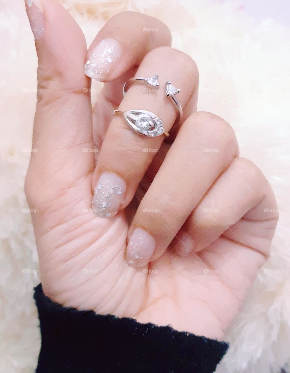 White gold rings on woman's finger. Close up