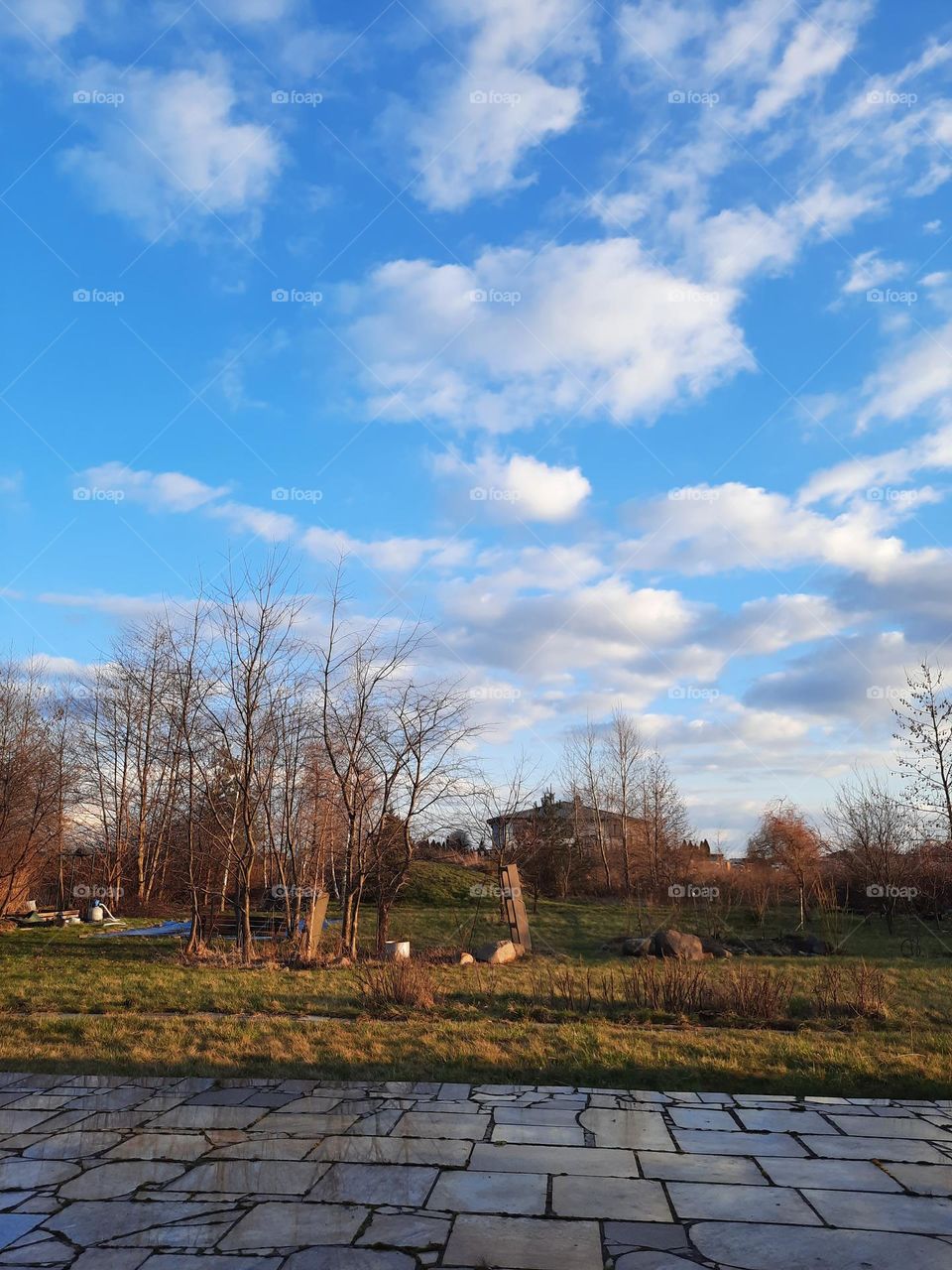 sky and clouds reflected in stone terrace