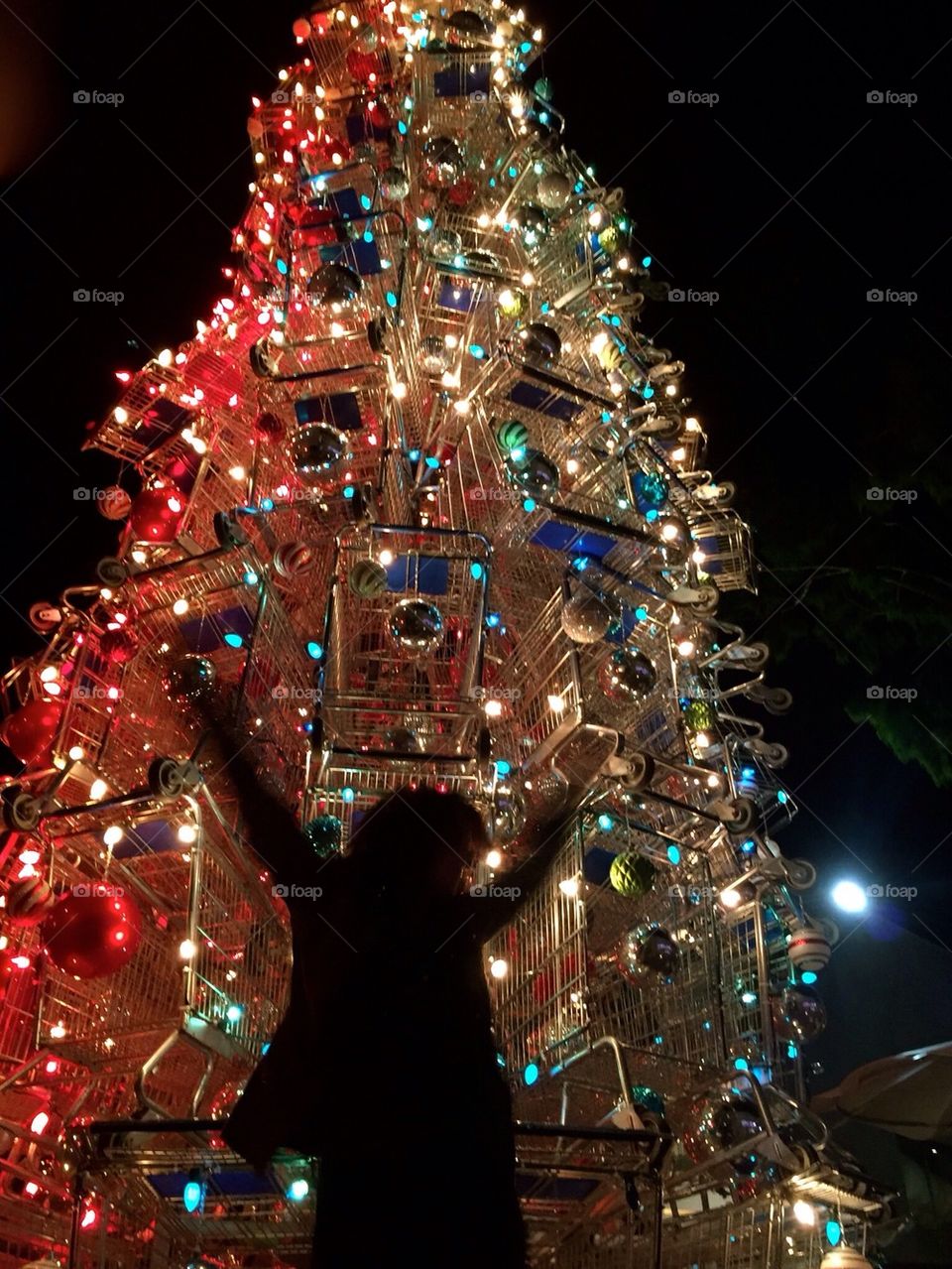 Dancing in front of the shopping cart Christmas tree 