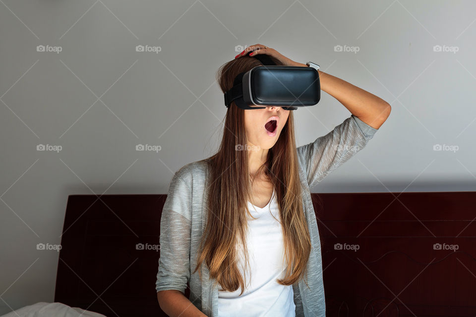 Woman using glasses of virtual reality 