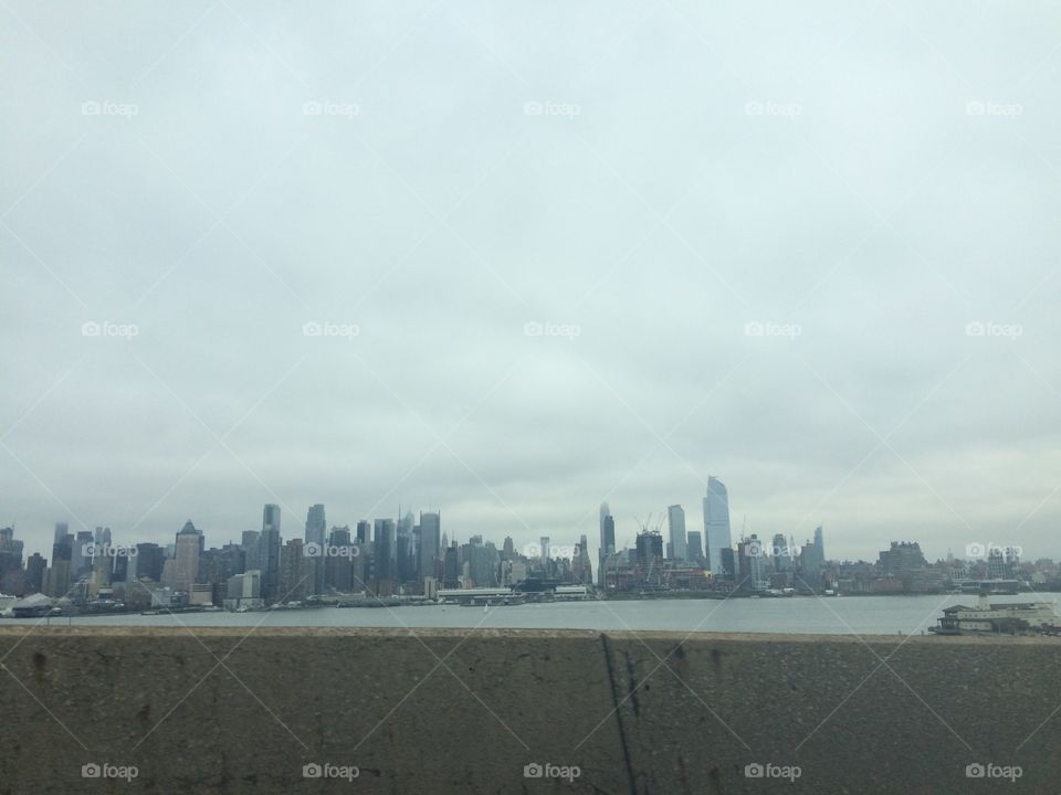 The skyline of New York City on a foggy day. 