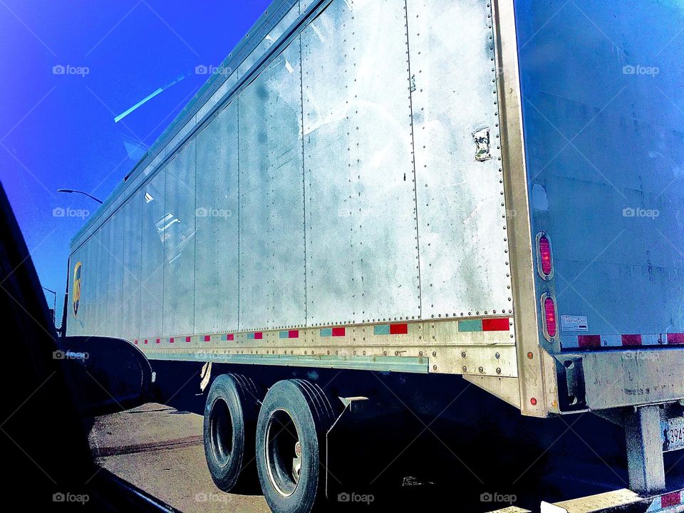 A shiny silvery metallic surface belonging to a truck passing by the car in which we were riding at the time. The angles look extra extreme but on closer inspection it turns out to be a mere illusion. 2020. Hypnotic Productions