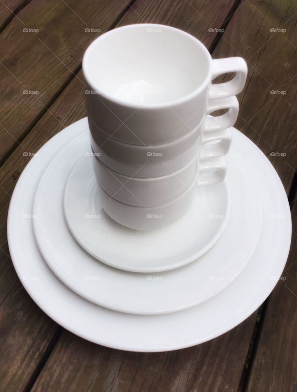 Objects. Stacked Mugs on Plates