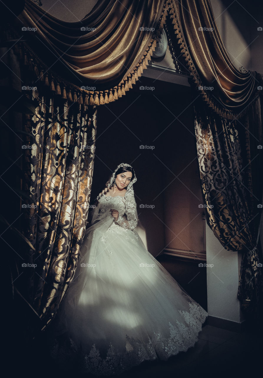 Pretty bride in wedding gown