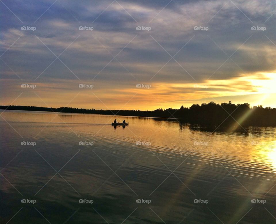 Canoeing at sunset. Watching canoes slide by