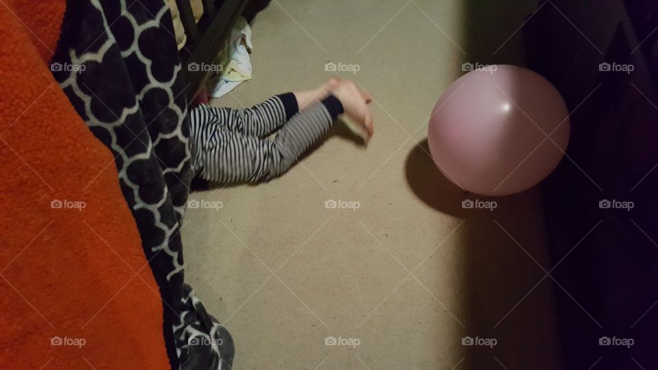 toddler crawling under the bed