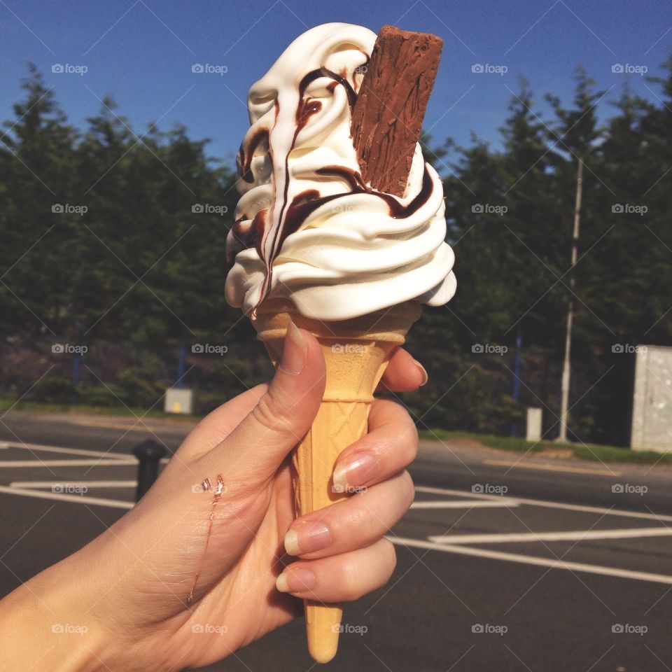 Ice cream. Hands holding ice cream