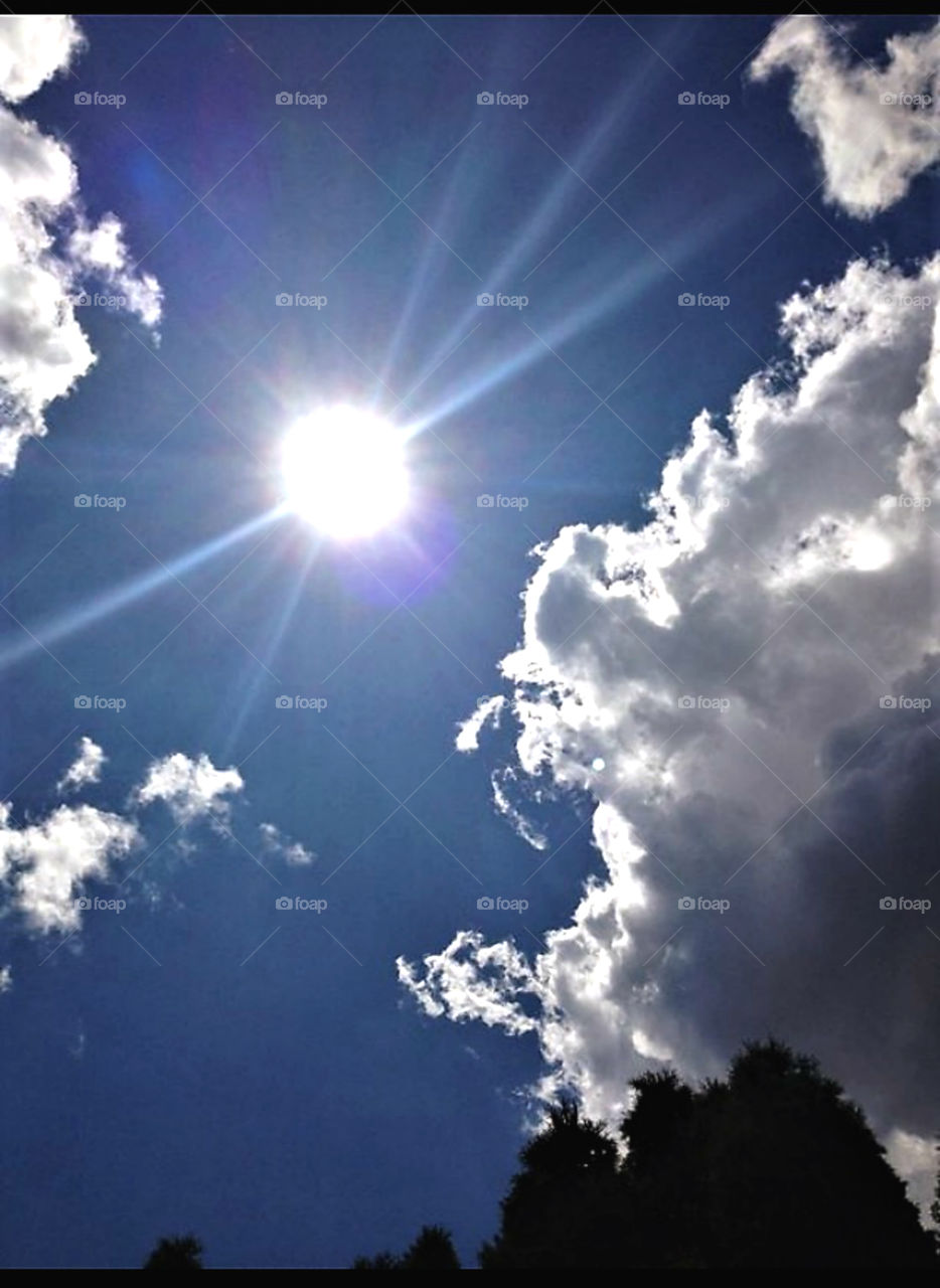 Sun Rays shining between the clouds