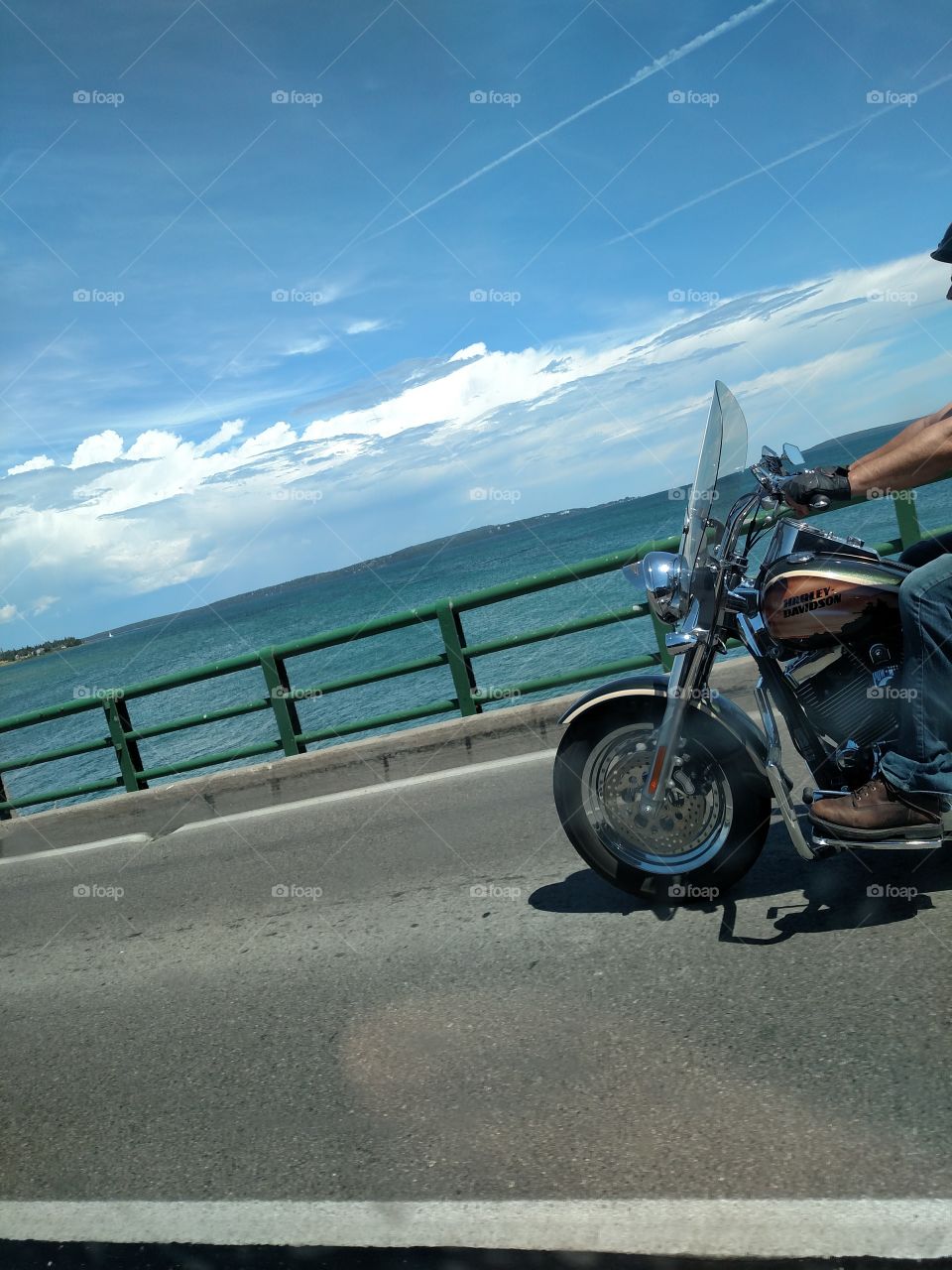 Motorcycle on the Mac. saw this biker enjoying the summer cruise across the bridge.