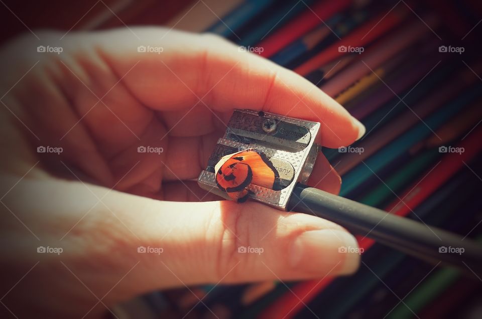 Hand Sharpening a Colored Pencil