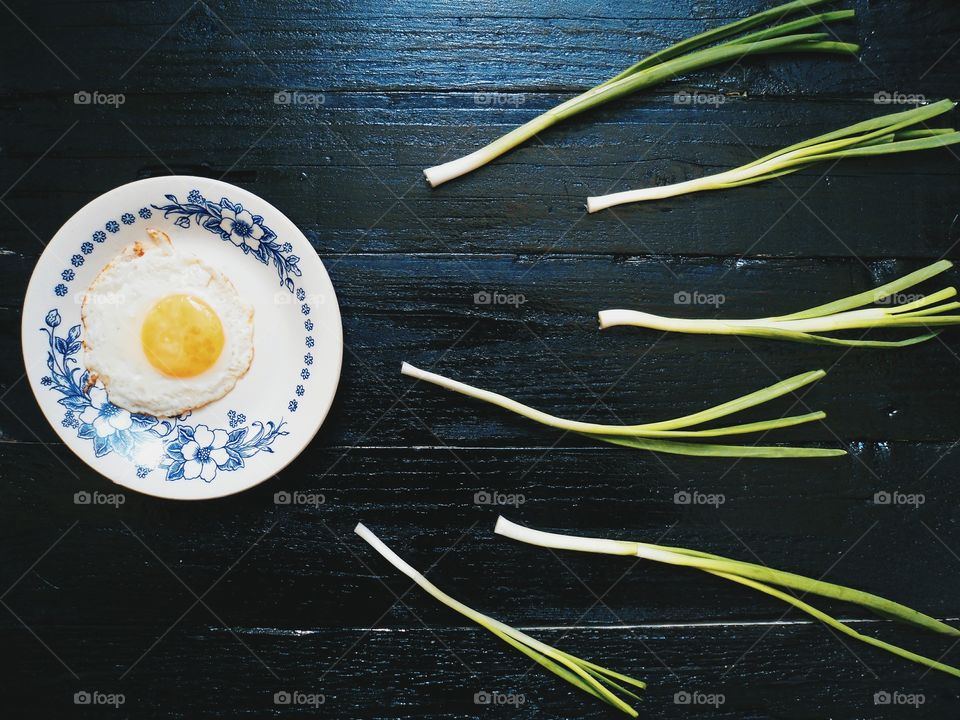 scrambled eggs and chives on black boards