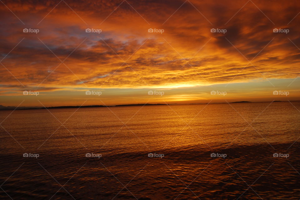 Scenic view of dramatic sky at sunset