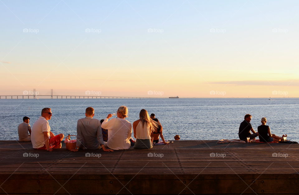 People enjoying the sunset in Malmö, Sweden.