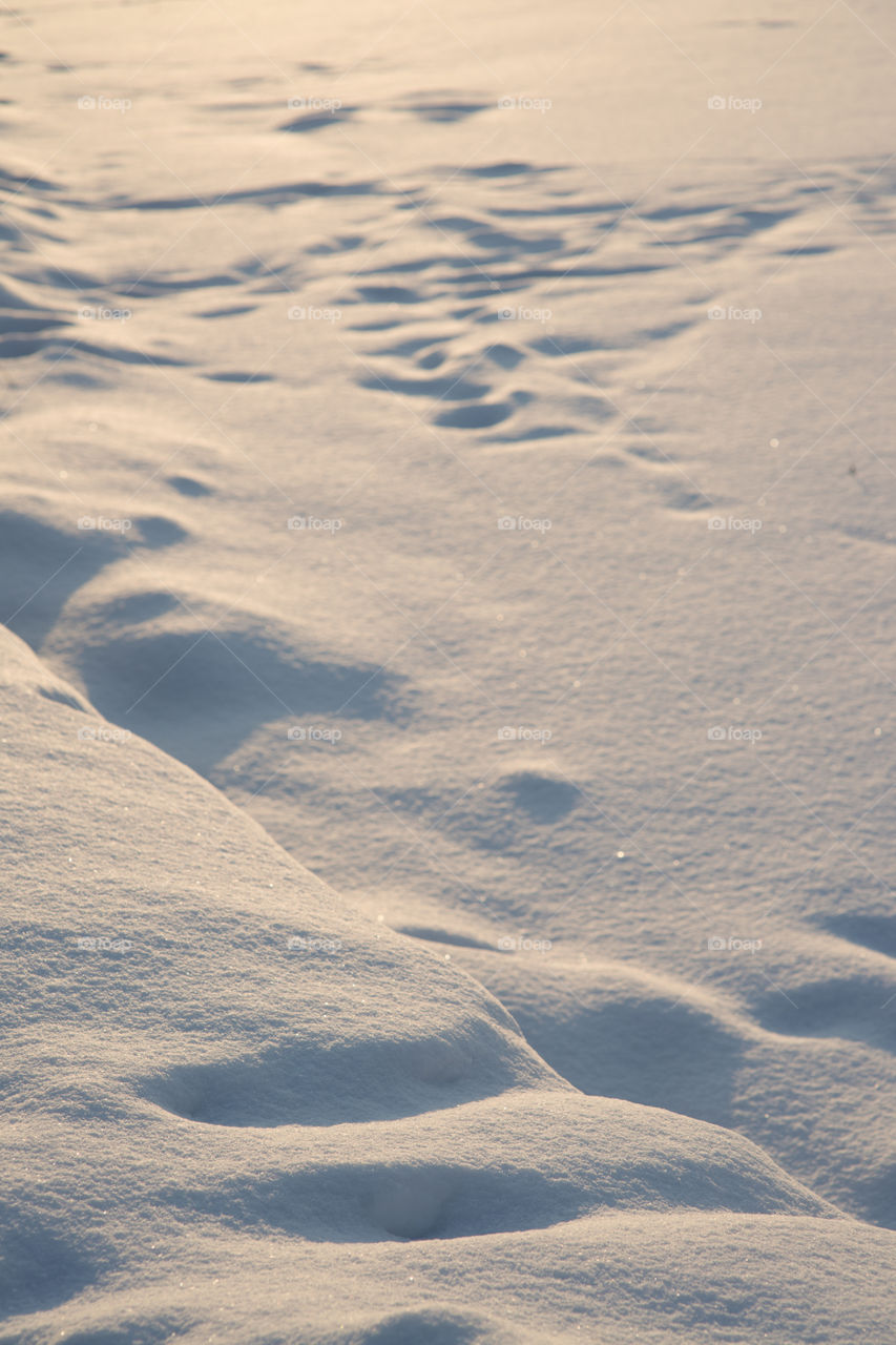 Natural winter background with bright snow drifts