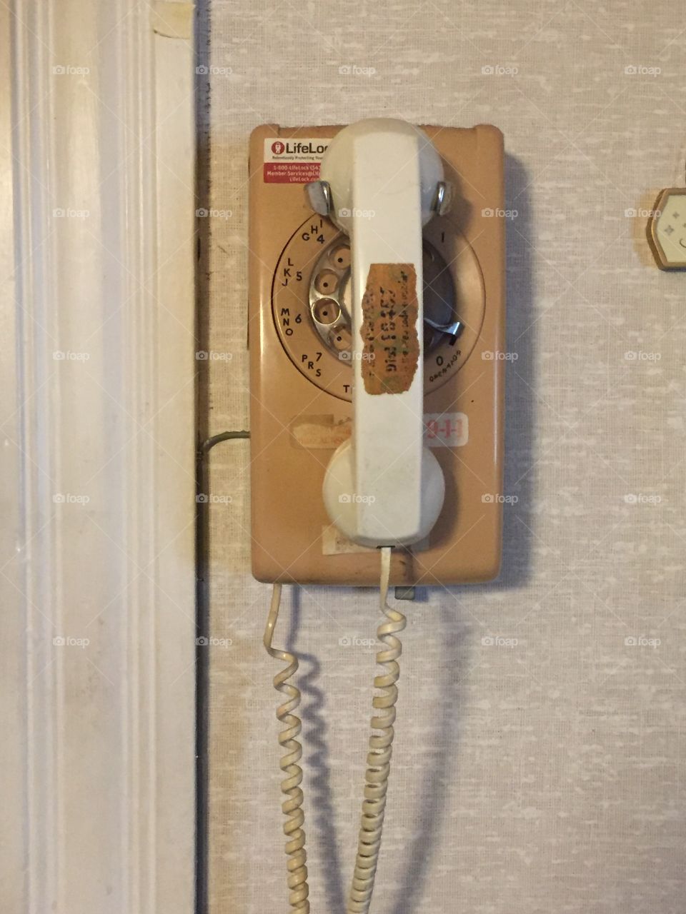 Rotary phone at my cousin's place, shown here with the phone on its hook. I like older objects.