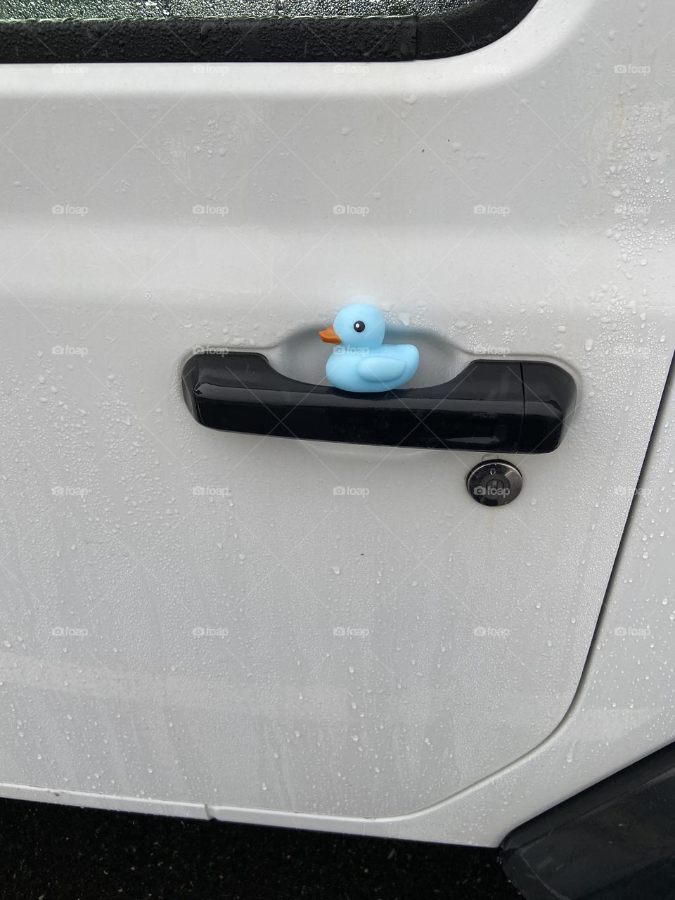 The door of my Jeep Wrangler with a blue rubber duck tucked in the door handle. I was “ducked” on a recent trip to a local shopping mall, Ocean County Mall in Toms River, NJ. I ran out to my car in the rain to find this little guy. #DuckDuckJeepNJ