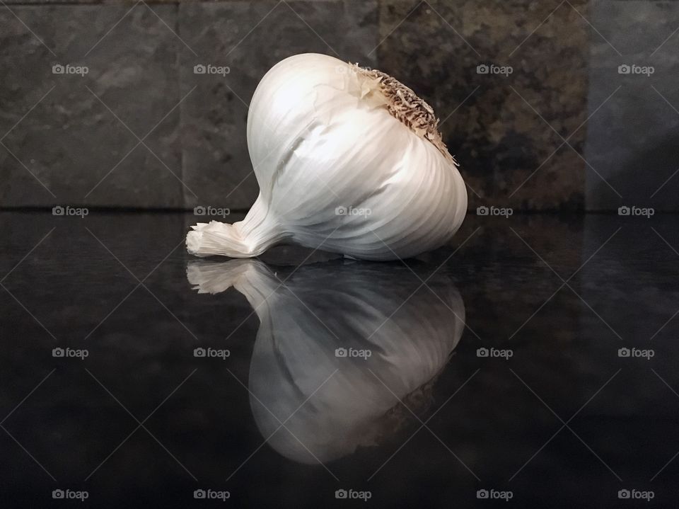 A reflection shot of an ear of garlic