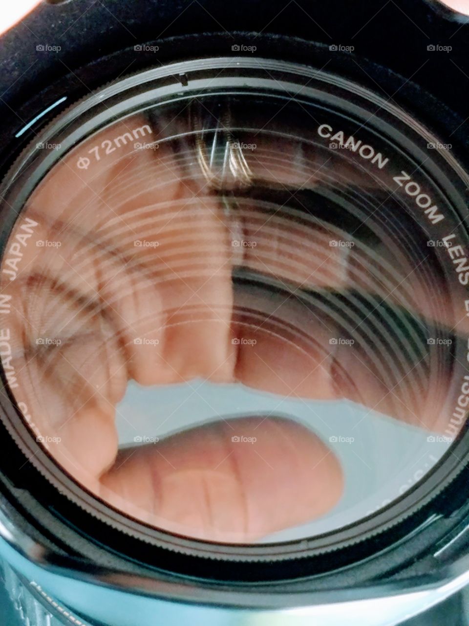 Reflection of hand on camera lens