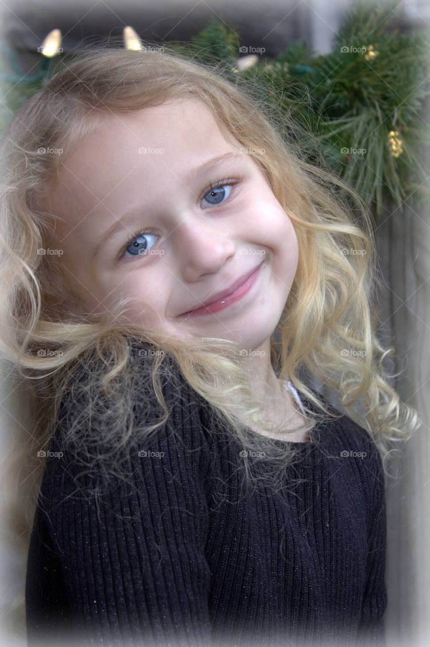 Beautiful little girl in a festive Christmas background. 