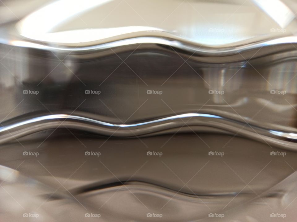 An interesting abstract photo of water bottle pattern with reflection