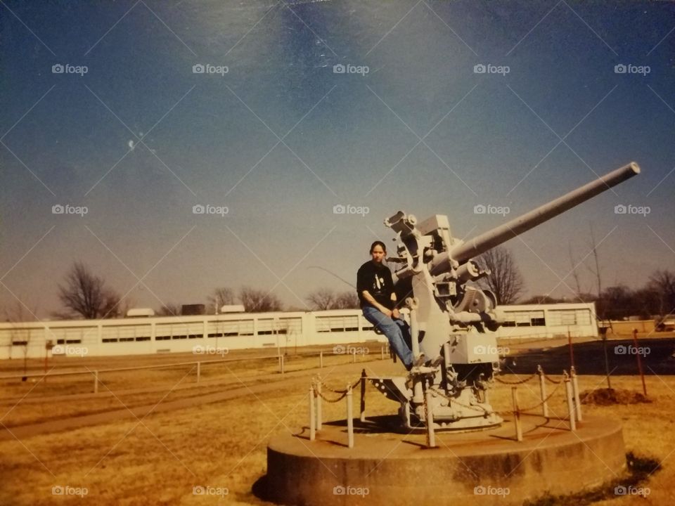 Sitting on an anti-aircraft gun im front of Nimitz Middle School here in Tulsa, Oklahoma.