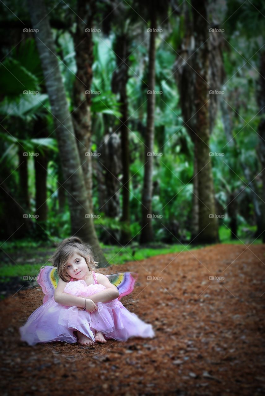 Portrait of cute girl with wings