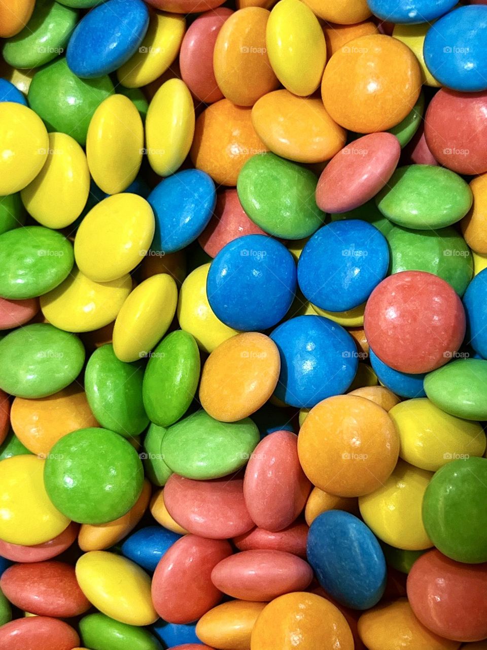 Multicolored dragee candies shot close-up. Background. Texture