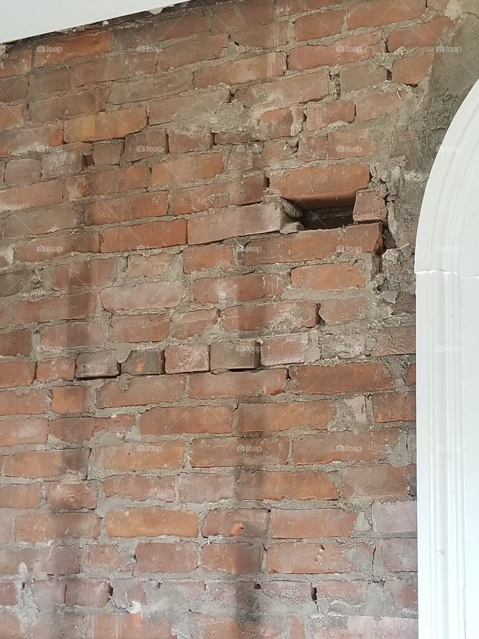 missing brick in interior wall