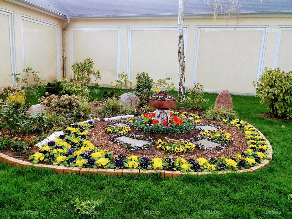flower bed in front of wall