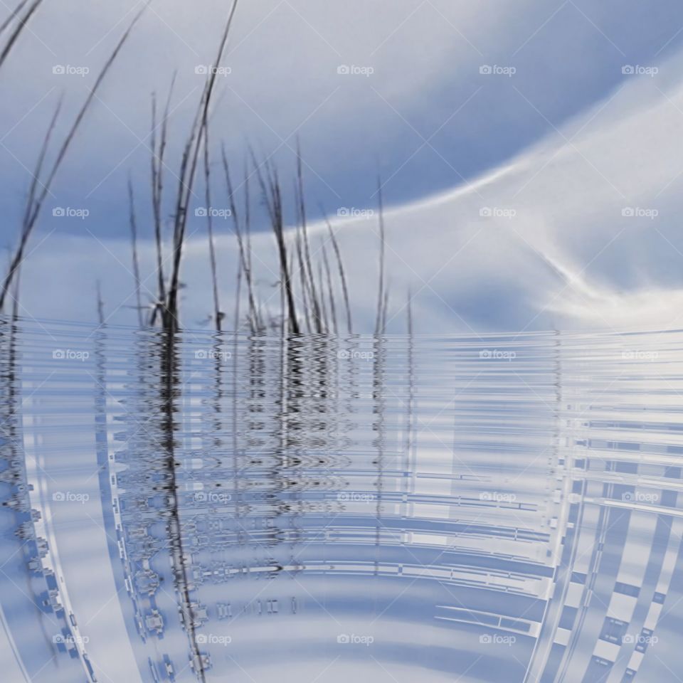 edited with fish eye waterfall and ripples white clouds over ocean sea oats in silhouette