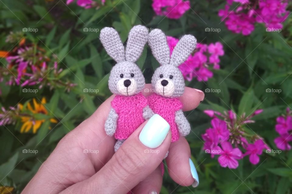 Handmade crocheted bunnies in pink dresses