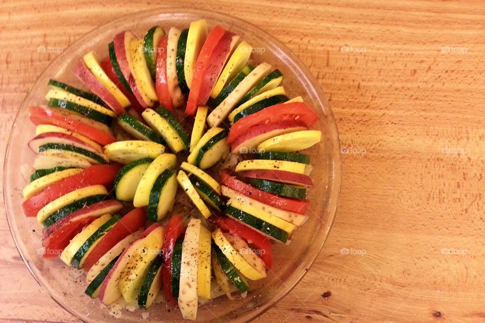 vegetable tian. Summer vegetable tian of zucchini, potatoes, tomatoes and yellow squash