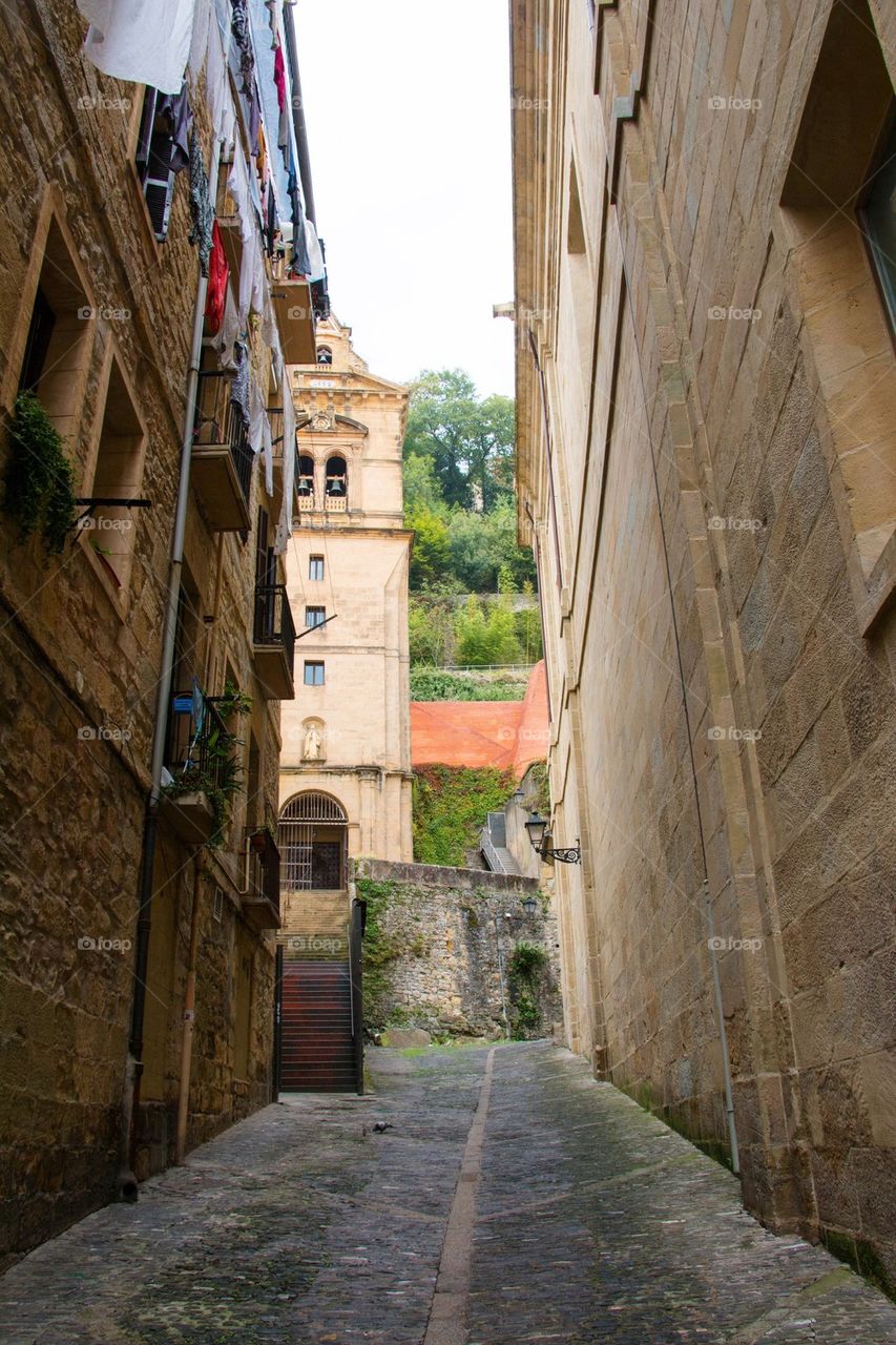 Narrow alley along buildings