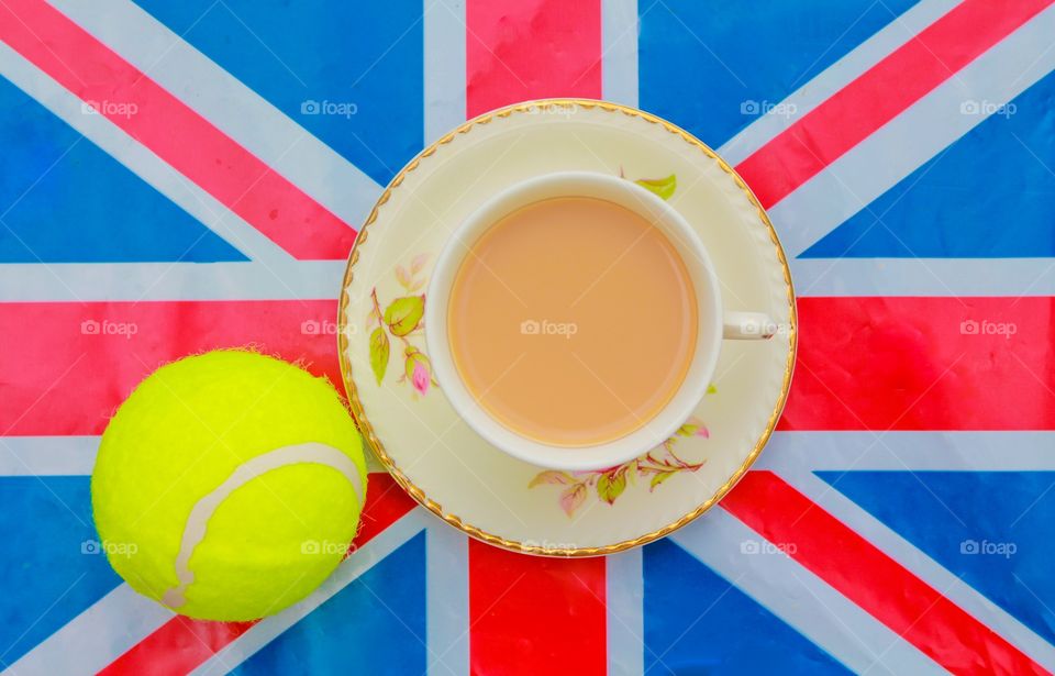 British tennis. A cup of tea and a tennis ball on a Union Jack flag 