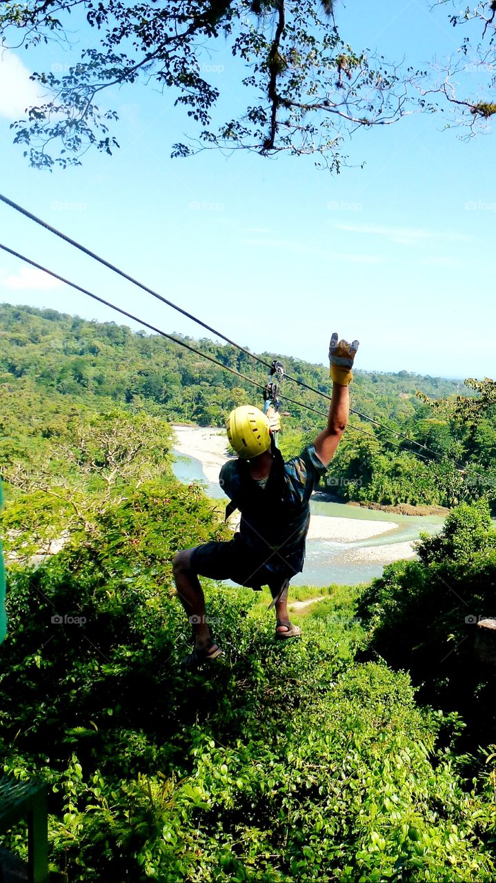 Zipping from Point A to B high in the Costa Rican rainforest canopy