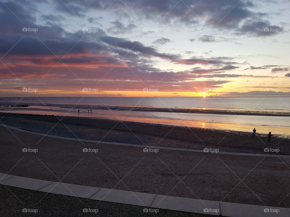 Sunset in cleveleys uk  , beautiful coloured sky and a small break in the clouds.