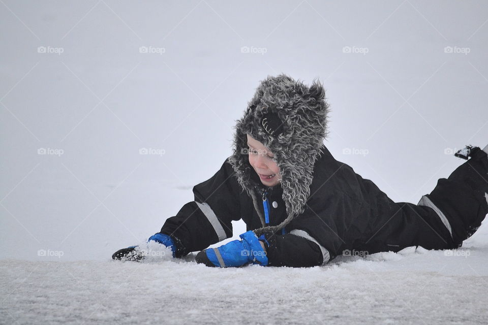 Boy playing in the snow