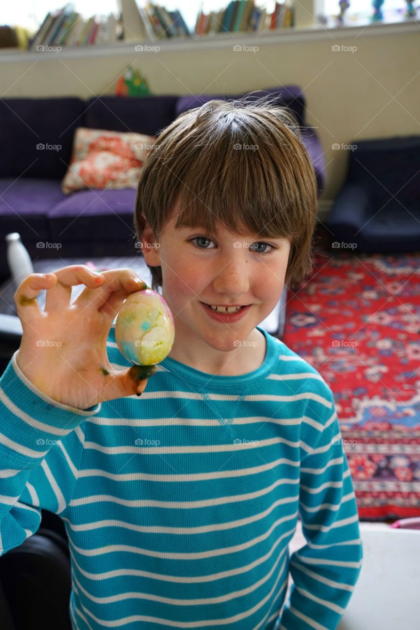 Boy Coloring Easter Eggs