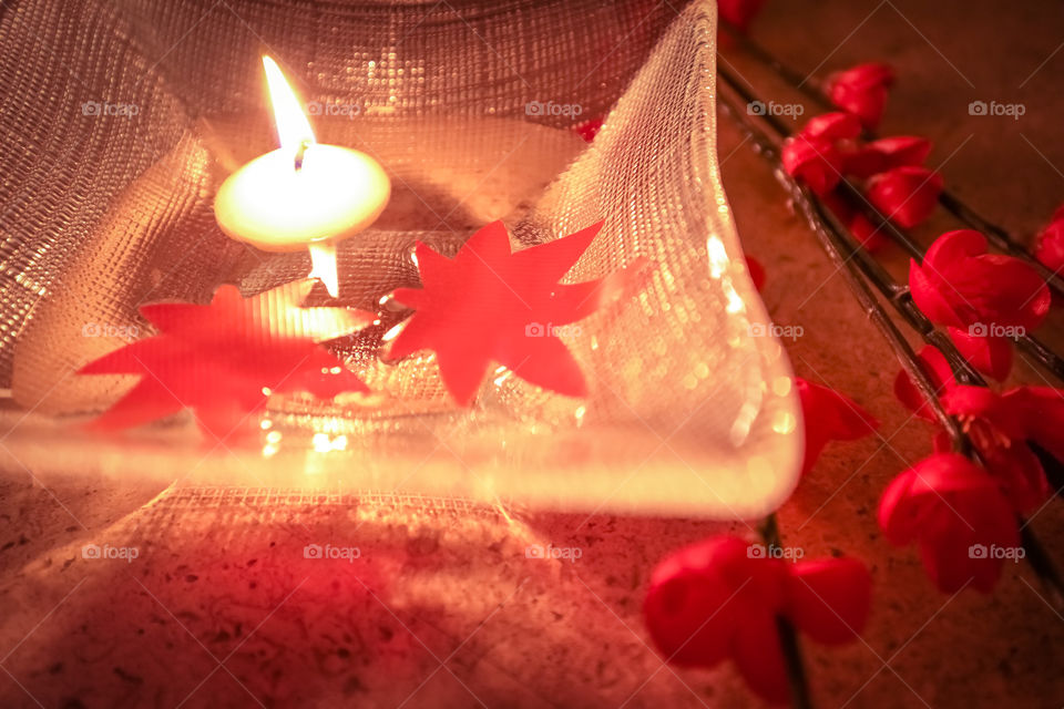 Table coordination. Japanese maple, red plum flowers, and floating candle to go with Japanese Autumn Flavors for dinner this evening at home.