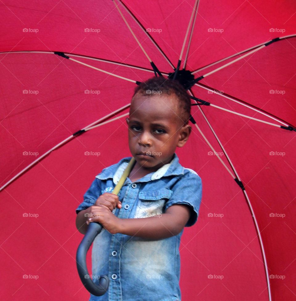 Kid with an umbrella