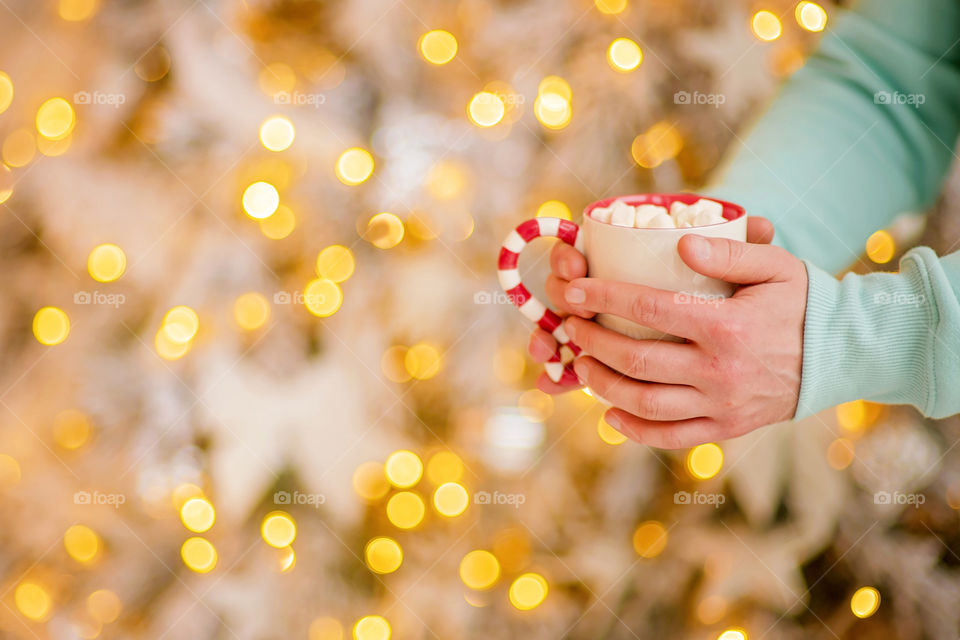 cup of coffee in a cozy festive Christmas atmosphere