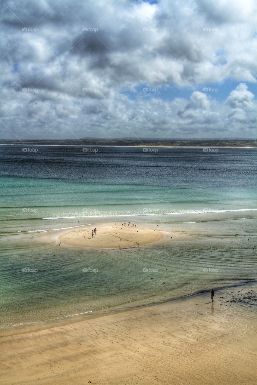 Sand Bank in Cornwall. A circular sandbank appears as the tide goes out.