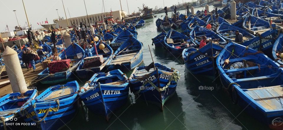 blue boats at the harbour in essaouira city in Morocco.