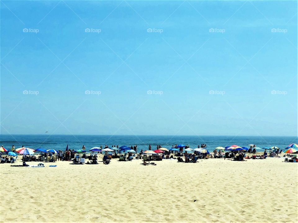 Soaking up the sun on beautiful summer day. Sand,sea, and rays. 