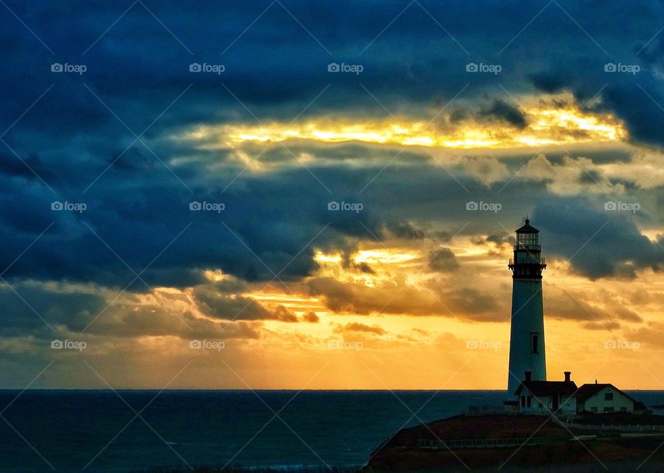 California lighthouse at sunset